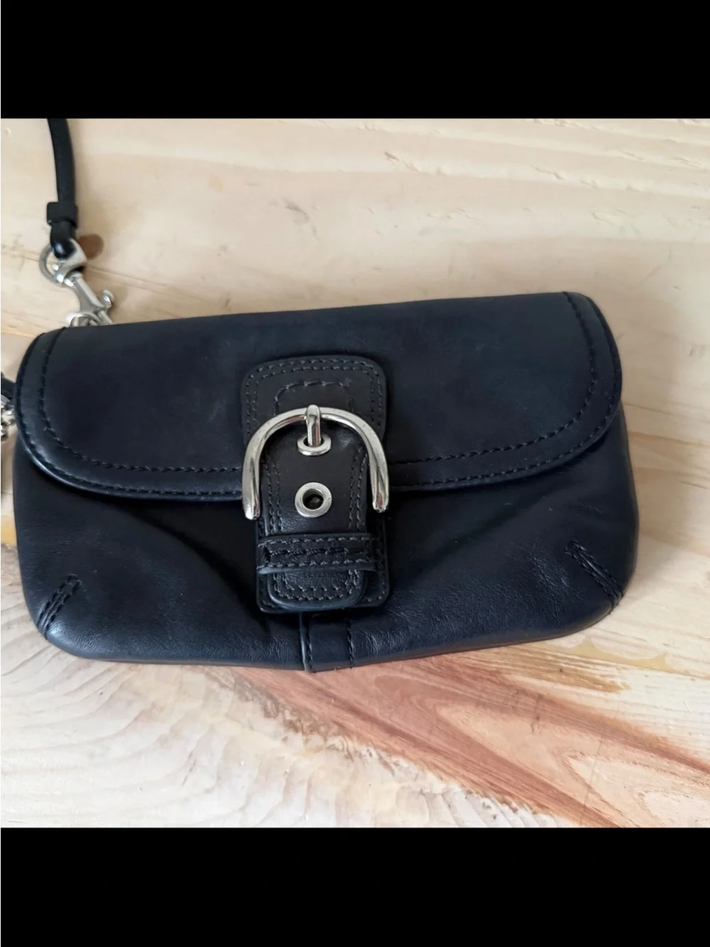 Coach, Soho, wristlet Black Leather Wristlet with Buckle Detail excellent condi